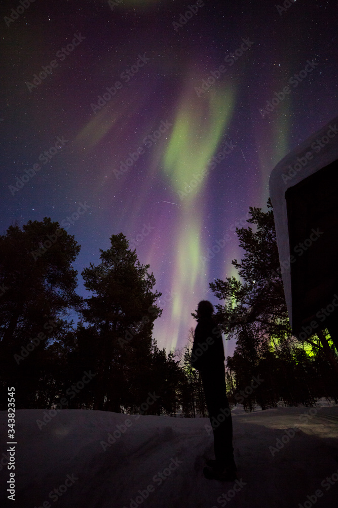 Northern lights in Inari Lake, Lapland, Finland