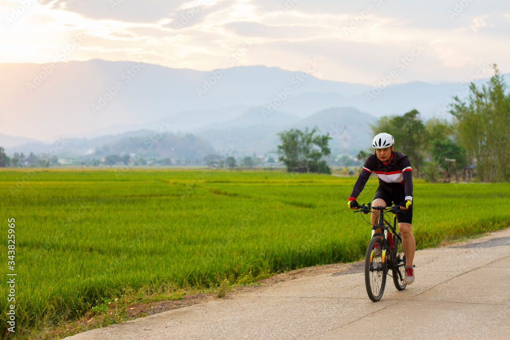 Asian men  ride on a mountain bike. Sport and active life concept.