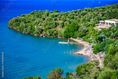 Spilios beach at Kommeno is close to Kerkyra is a paradise beach with crystal clear azure water in Corfu, Ionian island, Greece, Europe photo