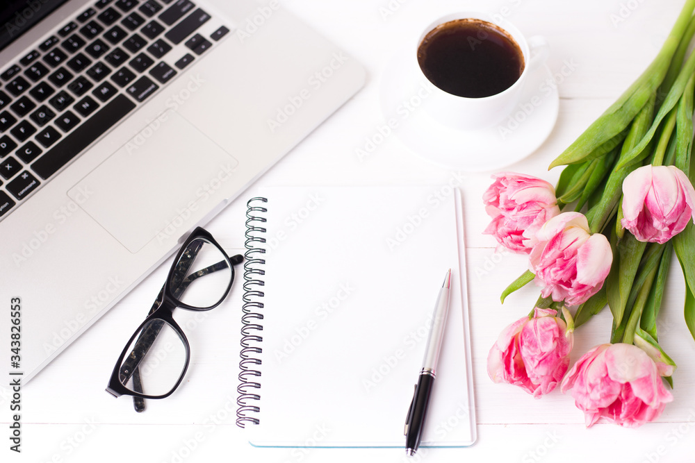 Pink tulips with a festive mood and coffee on white wooden boards. Pink tulips with a festive mood and coffee on white wooden boards.