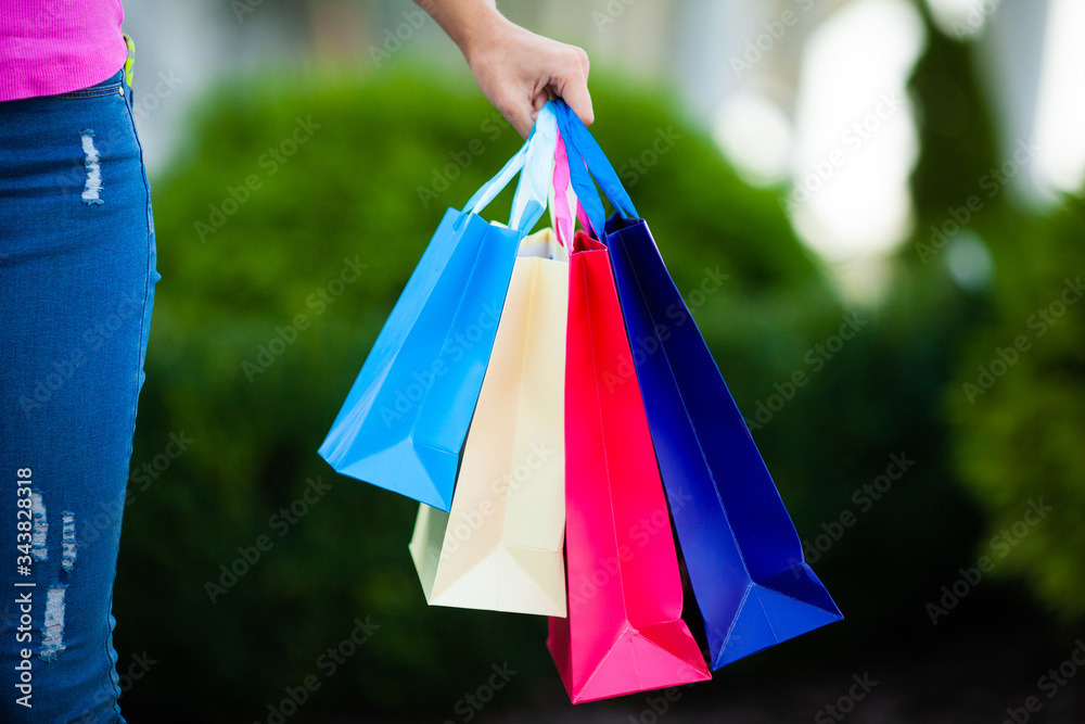 Woman holding shopping bags with new purchases