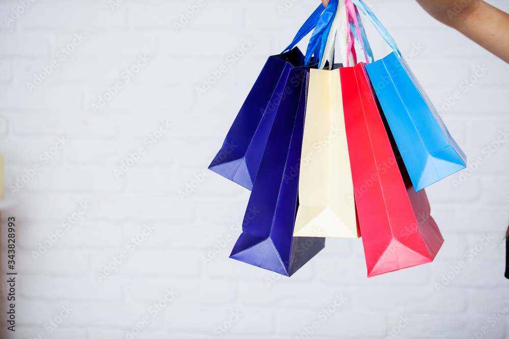 Woman holding shopping bags with new purchases