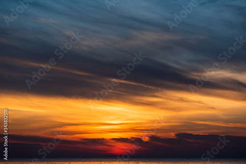cloudscape golden sky on the sea in summer time © unzenzer