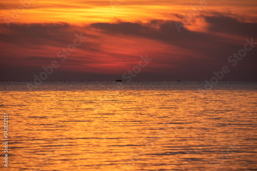 cloudscape golden sky on the sea in summer time