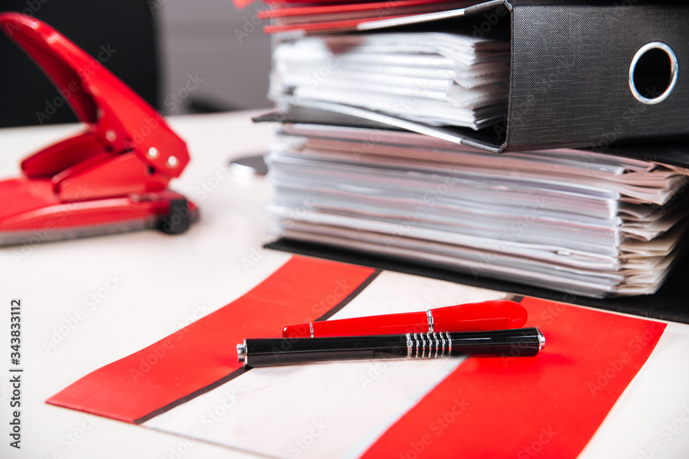 Office working place folders red colour table Office working place folders red colour table