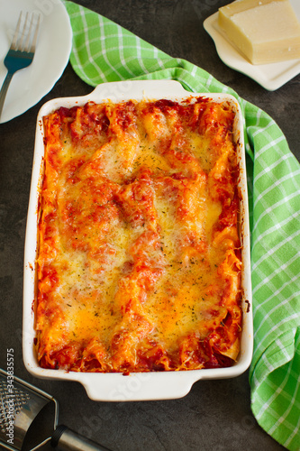 Hot tasty vegetable and cheese lasagna in ceramic casserole dish