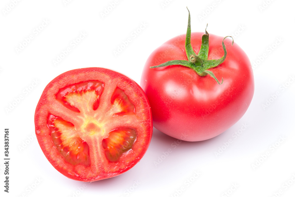 Red fresh tomatoes isolated on white background in close-up Red fresh tomatoes isolated on white background in close-up