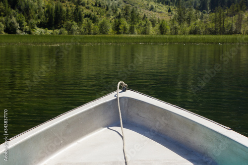 Bow of a leisure rowing boat on natural mountain lake in the Austrian Alps © Sander V.w.