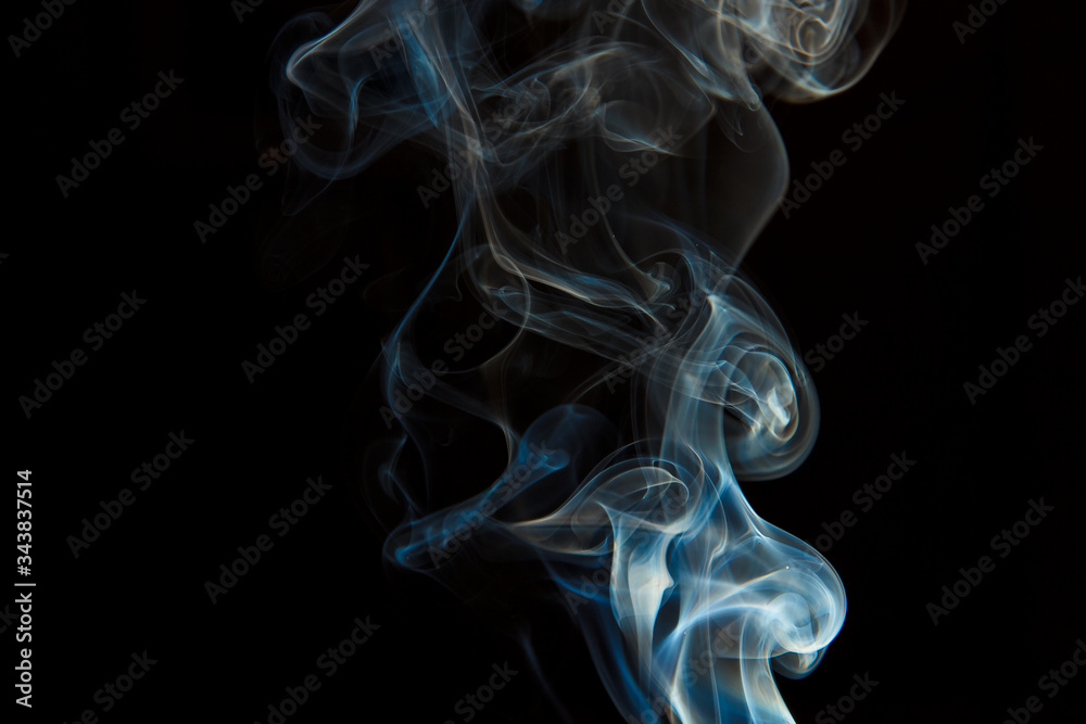 Smoke from an extinct candle on a black background Smoke from an extinct candle on a black background
