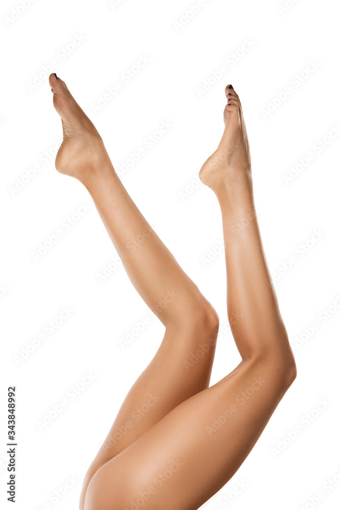 Beautiful female legs isolated on white background. Beauty, cosmetics, spa, depilation, treatment and fitness concept. Fit and sportive, sensual body with well-kept skin in underwear. Copyspace. Beautiful female legs isolated on white background. Beauty, cosmetics, spa, depilation, treatment and fitness concept. Fit and sportive, sensual body with well-kept skin in underwear. Copyspace.