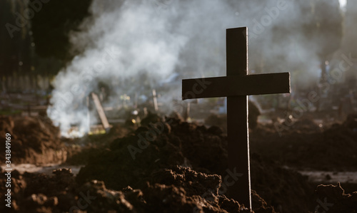 Cross, fire and death. After digging and removing the human rests of the graves, it seems a war landscape.