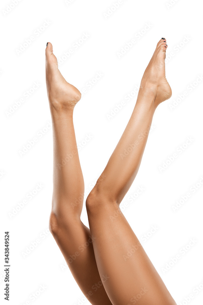 Beautiful female legs isolated on white background. Beauty, cosmetics, spa, depilation, treatment and fitness concept. Fit and sportive, sensual body with well-kept skin in underwear. Copyspace. Beautiful female legs isolated on white background. Beauty, cosmetics, spa, depilation, treatment and fitness concept. Fit and sportive, sensual body with well-kept skin in underwear. Copyspace.