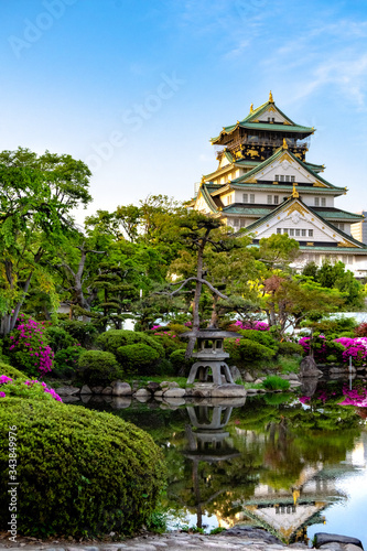 Photography Osaka castle at sunset on a clear day