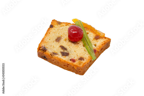 A slice of candied fruits cake with white background