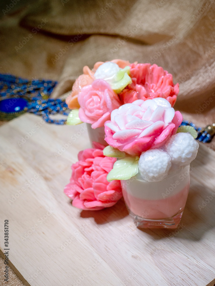 Agar jelly flower shape on wooden plate Agar jelly flower shape on wooden plate