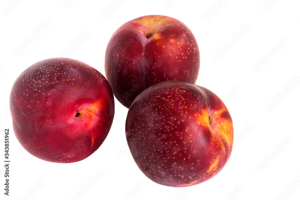 Fruits of red juicy plum isolated on a white background. Fruits of red juicy plum isolated on a white background.