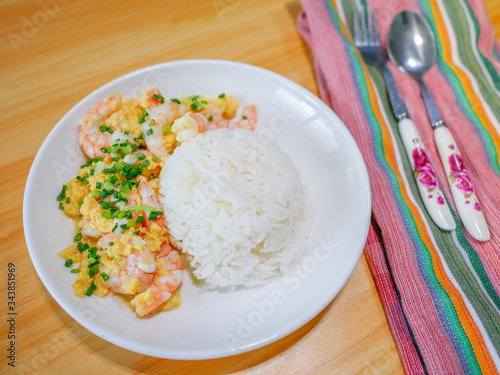 scrambled eggs with shripms and stream rice photo