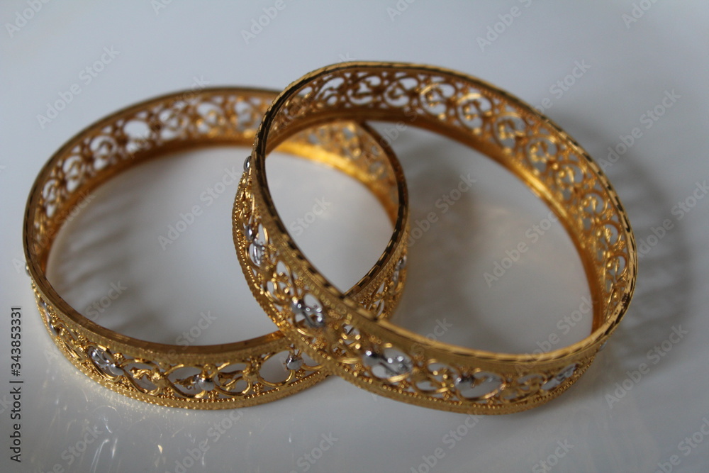 New model of gold bangles,isolated on white background. New model of gold bangles,isolated on white background.