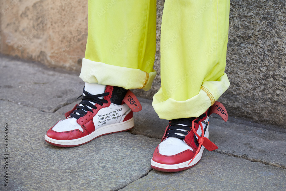 eternamente Contribución Y Man with white and red Nike Air Jordan sneakers and yellow jeans on January  14, 2018 in Milan, Italy foto de Stock | Adobe Stock