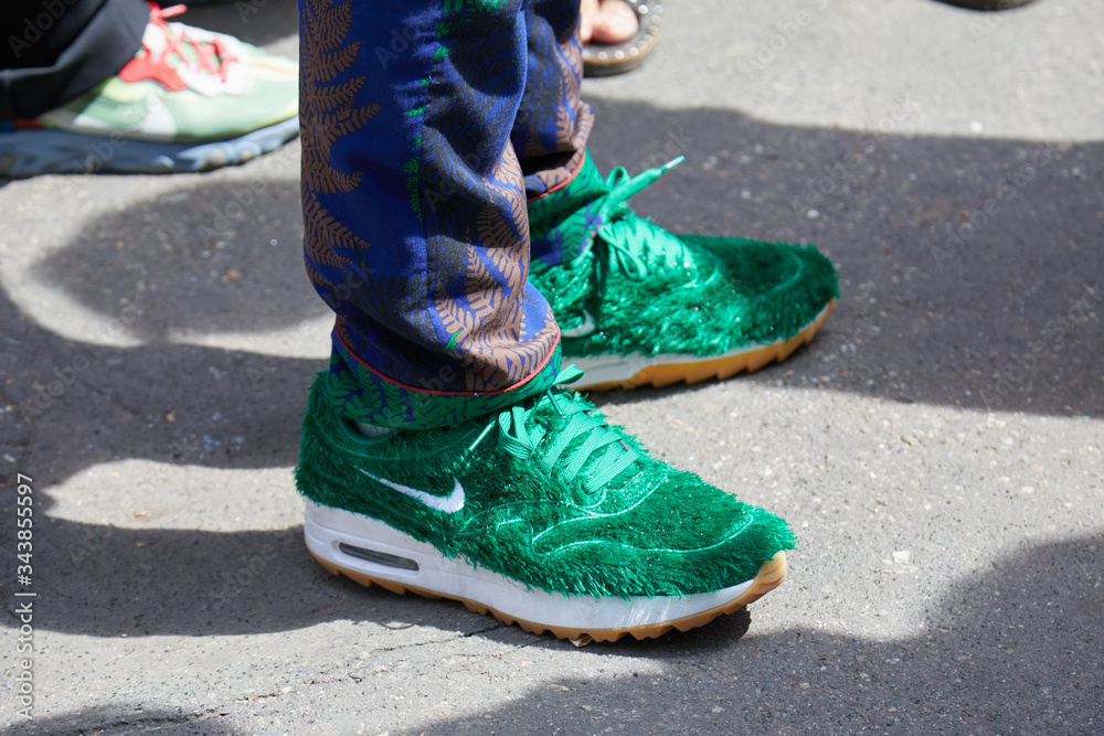 Man with Nike sneakers with green fur on June 15, 2019 in Milan, Italy  Stock Photo | Adobe Stock