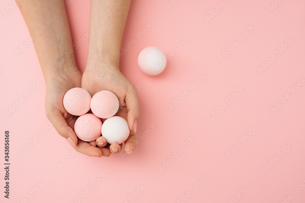 Spa concept. Bath bombs with woman hands Spa concept. Bath bombs with woman hands