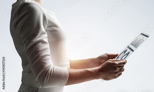 Woman hand touching virtual screen with pen