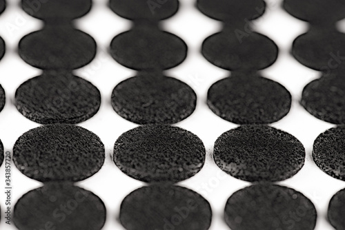 Pattern of black circles on white paper 