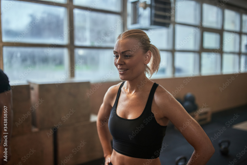 Fit young woman sweating after a gym workout session
