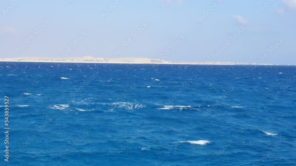 Luxury Yacht is in the Open Sea. Shore Appeared on the Horizon. Strong Waves are Beating Against the Side of the Boat. Luxury Yacht is in the Open Sea. Shore Appeared on the Horizon. Strong Waves are Beating Against the Side of the Boat.