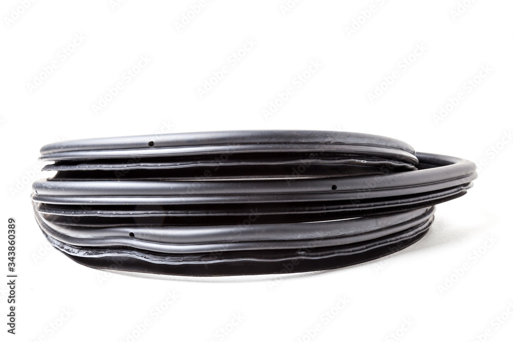 Black rubber sealant for elements of the auto body, doors or trunk, for noise insulation, thermal and sound, preventing heat loss in passenger compartment. Sealing gasket for repairs in car service. Black rubber sealant for elements of the auto body, doors or trunk, for noise insulation, thermal and sound, preventing heat loss in passenger compartment. Sealing gasket for repairs in car service.