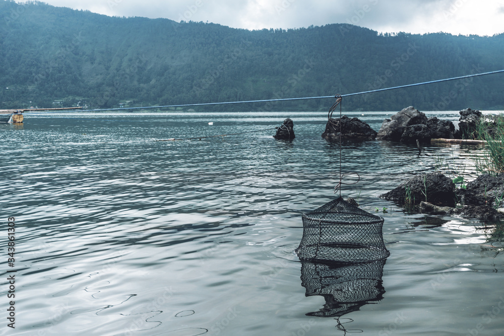 Obraz premium of old fish traps for fish standing in the water