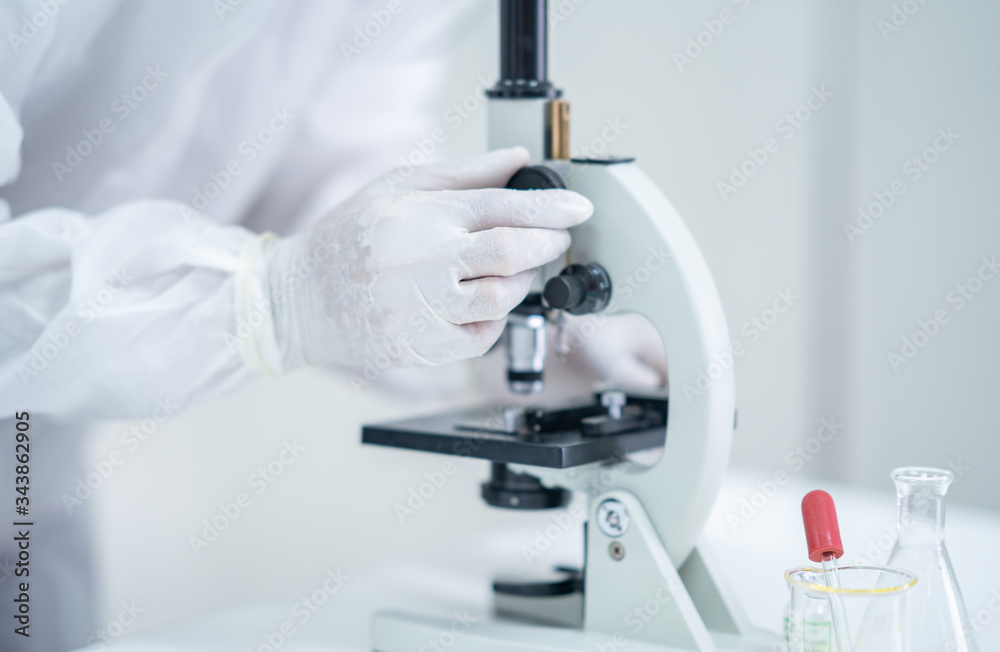Scientists experiment in labs with test tubes to find a vaccine against coronavirus Scientists experiment in labs with test tubes to find a vaccine against coronavirus