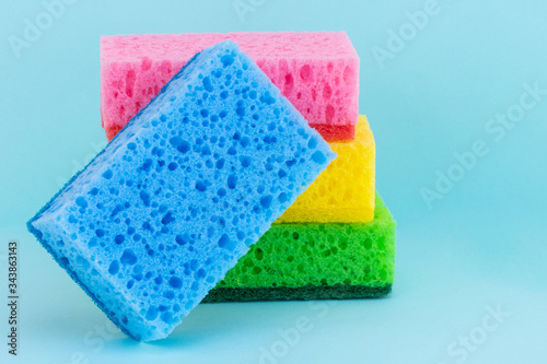 sponges for dishwashing on a blue background