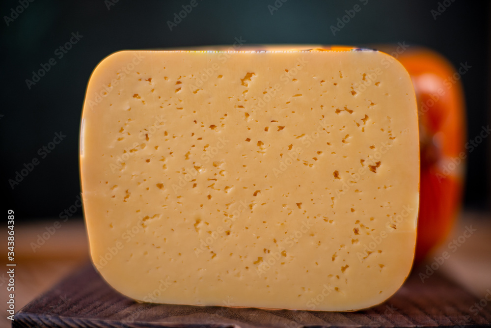 Ταπετσαρία Medium hard cheese gouda edam on wooden board on sunlight table traditional tabl