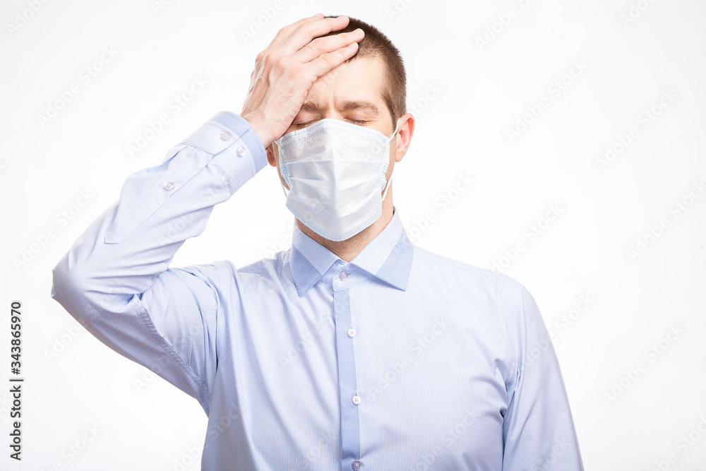 distressed man put his hand on his head, closed his eyes, experiencing sadness and pain, in a blue light shirt. Isolated distressed man put his hand on his head, closed his eyes, experiencing sadness and pain, in a blue light shirt. Isolated