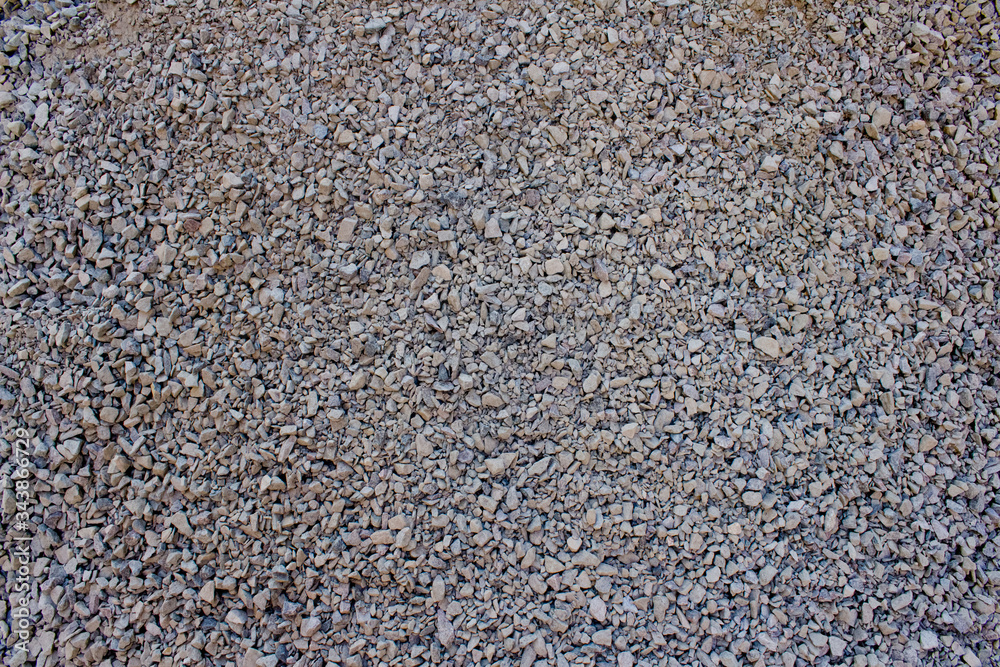 Stone crumb as creative textured background for your design, granite gravel backdrop with copyspace Stone crumb as creative textured background for your design, granite gravel backdrop with copyspace