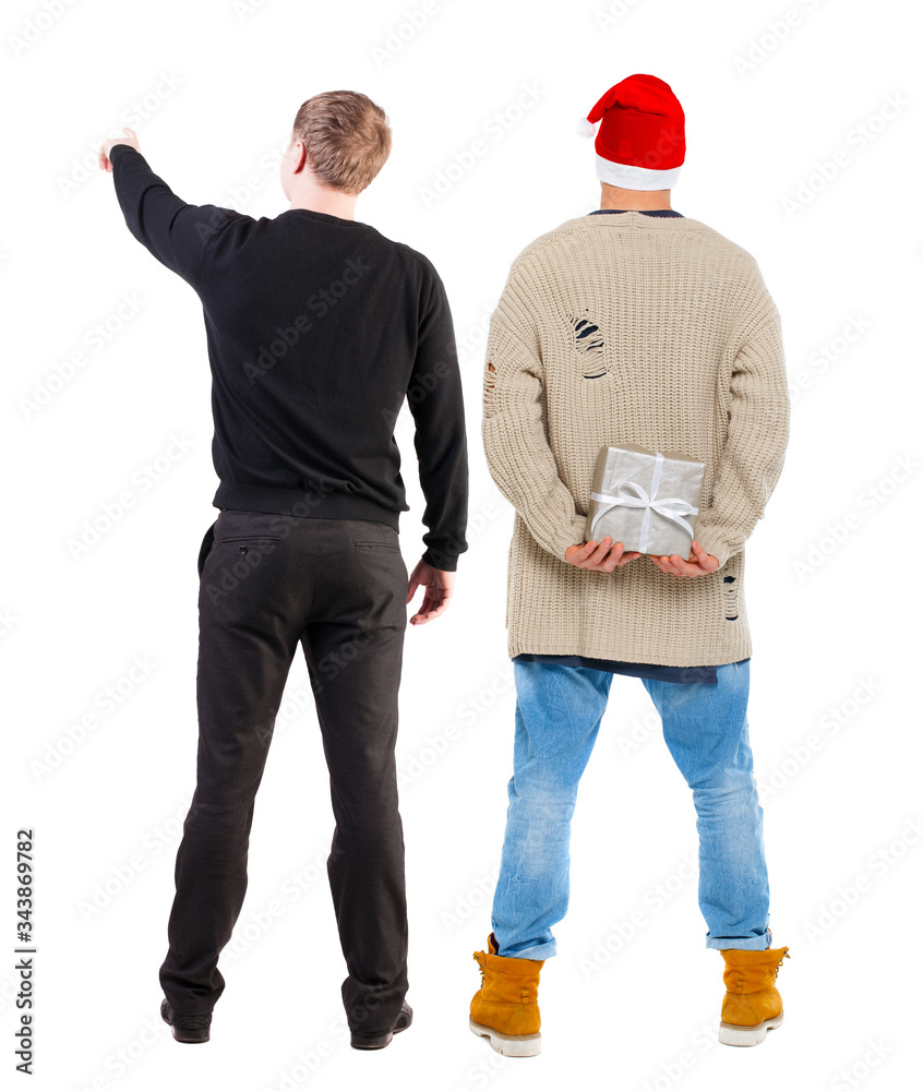 Back view of two man in sweater pointing. Back view of two man in sweater pointing.