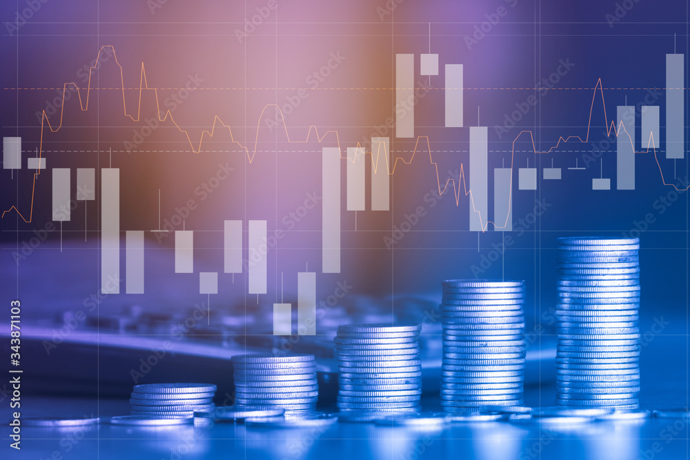 Stack of money coin with trading graph, financial investment concept can be use as background Stack of money coin with trading graph, financial investment concept can be use as background