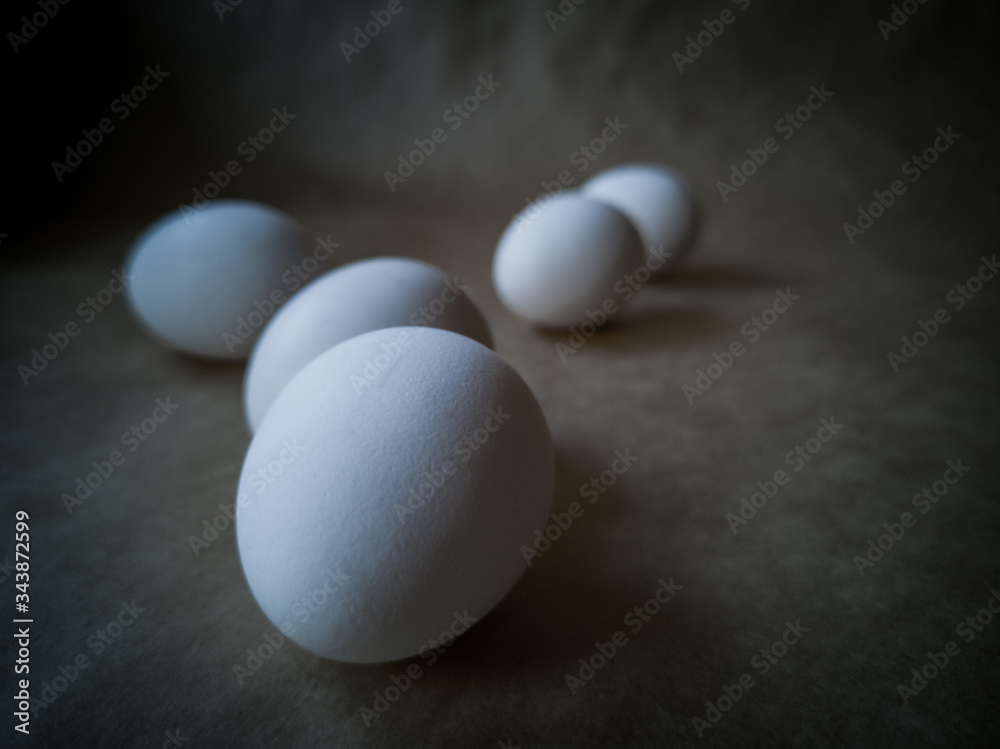 Close-up view of raw chicken eggs . Eggs on a dark background Close-up view of raw chicken eggs . Eggs on a dark background
