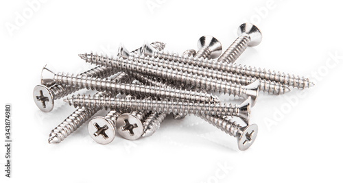 Close-up on screws, metal screws, iron screws, wood screws isolated on white background