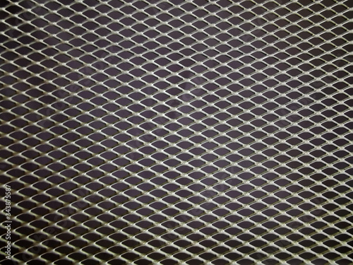  gray metal mesh on a dark background abstract background