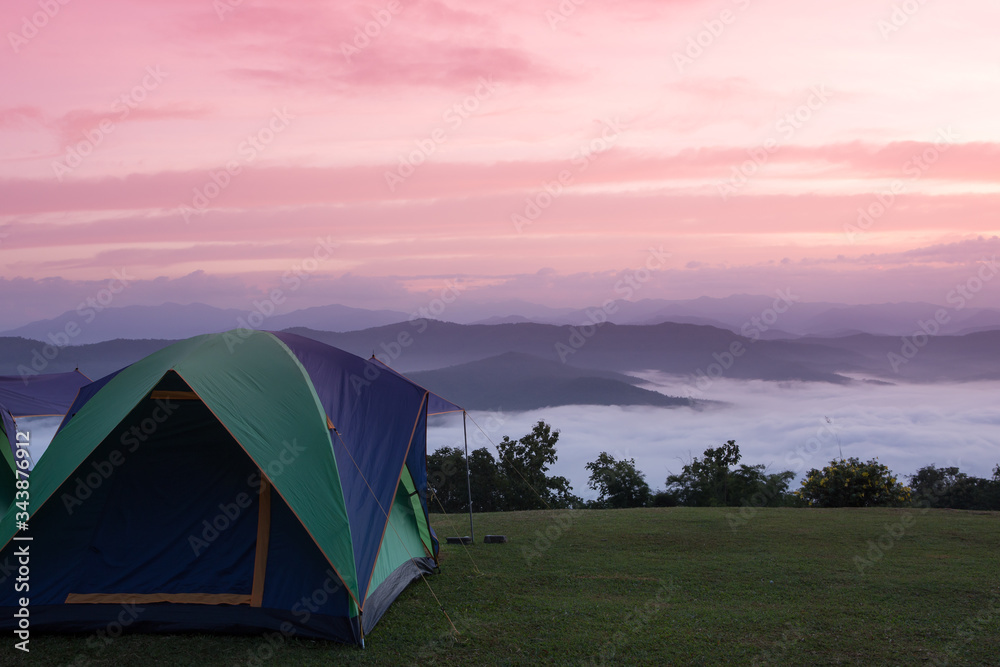 tourist tent in the sunrise and fog