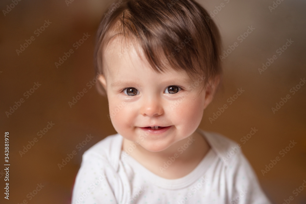 Beautiful baby girl smiling happily. Beautiful baby girl smiling happily.