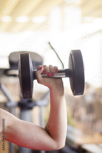Young woman training in the gym happy