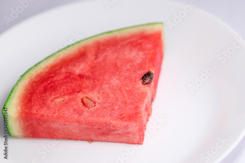 close up of pieces watermelon on dish white 