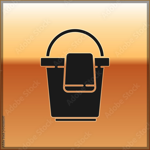 Black Bucket with rag icon isolated on gold background. Cleaning service concept.  Vector Illustration