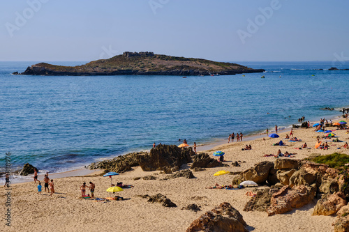 Beach Island and Fort of Praia da Ilha do Pessegueiro. Solo Backpacker Trekking on the Rota Vicentina and Fishermen's Trail in Alentejo, Portugal. Walking between cliff, ocean, nature and beach.