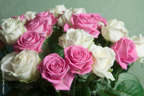 Roses posy over green background