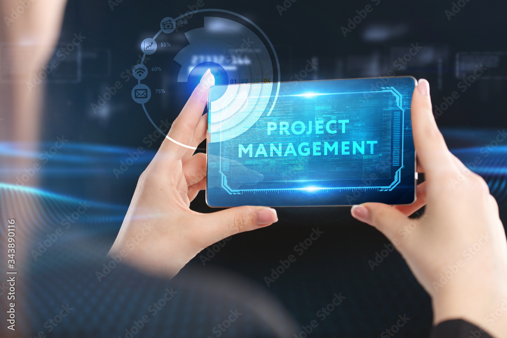 Business, Technology, Internet and network concept. Young businessman working on a virtual screen of the future and sees the inscription: Project management Business, Technology, Internet and network concept. Young businessman working on a virtual screen of the future and sees the inscription: Project management