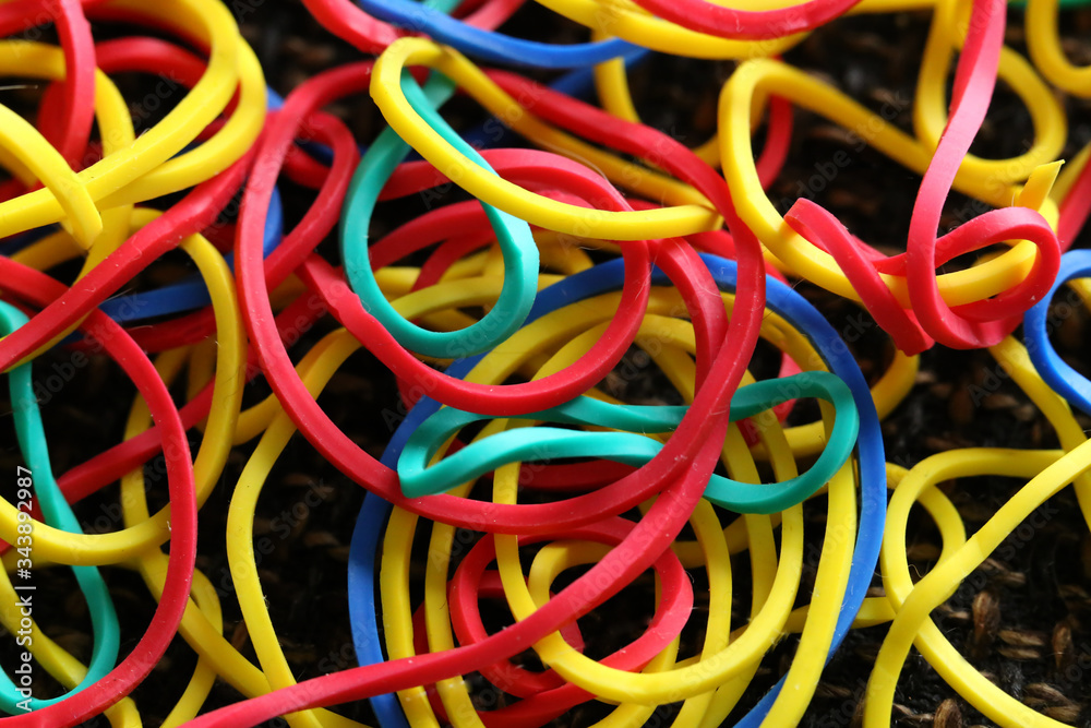 Multi-colored elastic band rubber scattered on the table